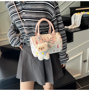 Pink floral Boston bag with cute cartoon patterns and a white teddy bear charm accessory