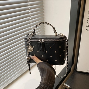 Quilted black chain crossbody box bag with silver studs and camellia floral charm