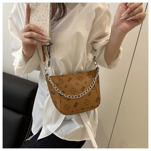 Brown crossbody bucket bag with cartoon bear print and silver metal chain detail