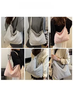 Detailed views of striped canvas tote bag showing high capacity and wide shoulder strap design