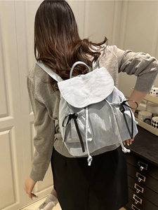 Light blue minimalist bucket backpack with NIKA embroidery and cute bow side pockets