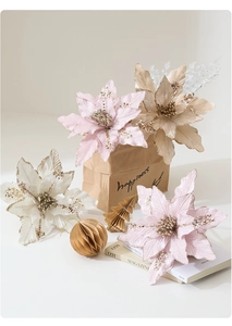 Detail of velvet Christmas flowers with glitter edges in pink, white and champagne colors