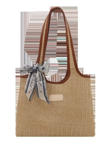 Summer woven straw tote bag with brown leather handles and a decorative Paris silk scarf