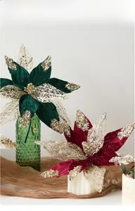 Detail of velvet Christmas flower with gold sequins and beads on white background
