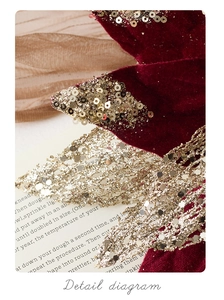 Macro detail of red velvet Christmas flower with sparkling gold sequins and glitter edges