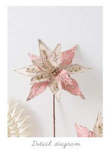 Detailed view of pink and beige fabric poinsettia flower with shimmering gold sequins