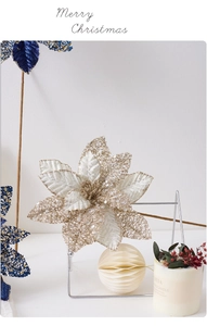 Detail of champagne gold mesh Christmas flower with silver sequins and beadwork decor