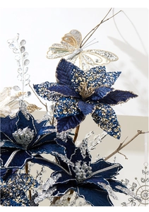 Detail of luxury blue velvet Christmas flower with gold sequins and decorative butterfly
