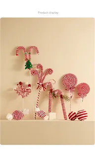 Detailed close-up of velvet red and white candy cane Christmas tree hanging ornaments
