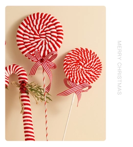 Detail of red and white striped velvet candy cane and lollipop Christmas tree ornaments