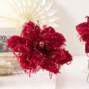 Artificial burgundy Christmas magnolia flower with glitter petals and velvet texture