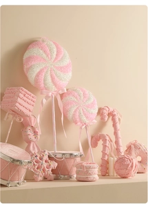 Pink and white candy-themed Christmas ornaments including lollipops and snowflakes