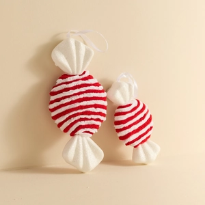 Red and white velvet candy cane Christmas ornaments with glitter details and white ribbons