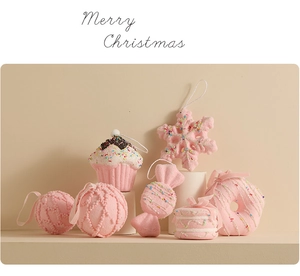 Pink Christmas ornaments collection featuring cupcake and candy shapes on white stands