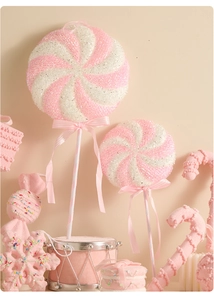 Pink lollipop and candy cane Christmas tree ornaments with glitter and ribbon bows