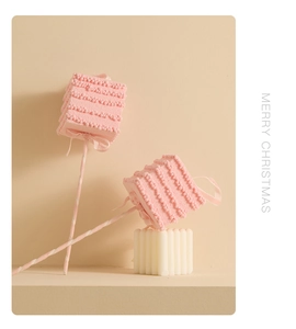 Pink lollipop ornament with ribbon and snowflake details for Christmas tree decoration
