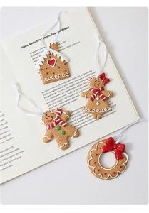 Λεπτομέρεια από σπιτάκι και ανθρωπάκι gingerbread με υφή γλάσου πάνω σε σελίδες βιβλίου
