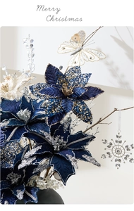 Detail of dark blue silk poinsettia with gold sequins and white butterfly pendant decoration