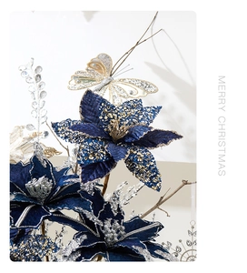 Close-up of dark blue velvet Christmas flower with golden sequins and silver glitter details