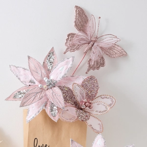 Pink Christmas floral set with velvet flowers and glitter butterflies in a paper bag