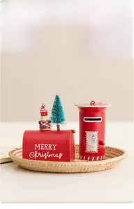 Close-up of red vintage Christmas metal mailboxes with nutcracker and pine decorations
