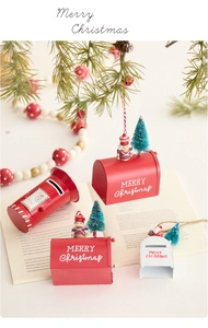Close-up of mini iron Christmas mailboxes with nutcrackers and mini trees festive decor