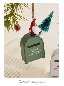 Detail of green Christmas mailbox ornament with mini elf and snowy pine tree decor