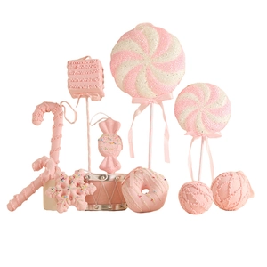 Pink and white Christmas tree ornaments set with lollipops, candy canes, and snowflakes