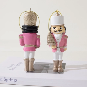 Pink and white resin Nutcracker soldier Christmas tree ornaments with gold glitter accents