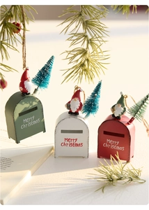 Close-up of vintage metal Christmas mailboxes with gnomes and Merry Christmas text