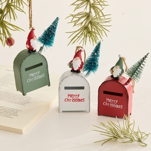 Three colorful Christmas mailbox ornaments with tiny gnomes and mini trees on pine branches