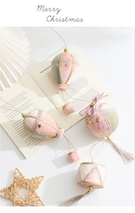 Detail of pink and mint velvet Christmas ornaments with gold trim and pearls