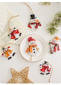 Set of 6 handcrafted Christmas snowman resin ornaments with festive knitted scarves and rope