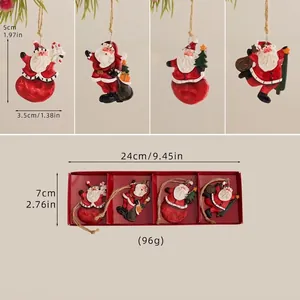 Detailed view of hand-painted resin Santa Claus ornaments set with rustic twine hangers