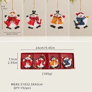 Detailed view of four colorful resin snowman ornaments in a red gift packaging box