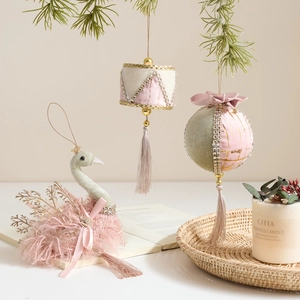 Pink and sage green velvet Christmas ornaments with swan shape and elegant tassels
