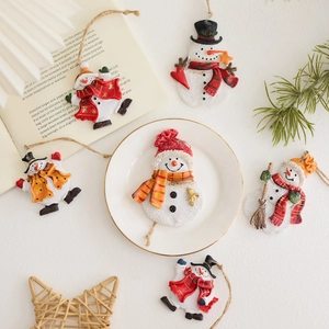 Set of six resin Christmas snowman ornaments with festive hats and colorful scarves