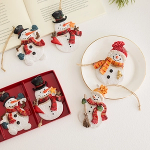 Handcrafted resin snowman Christmas tree ornaments with festive scarves and accessories