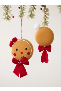 Detail view of plush gingerbread man and chef hat ball Christmas tree ornaments