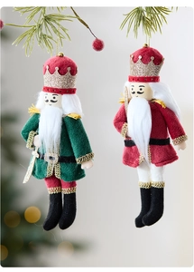 Detailed plush nutcracker soldier ornaments with glitter crowns and golden hanging cords