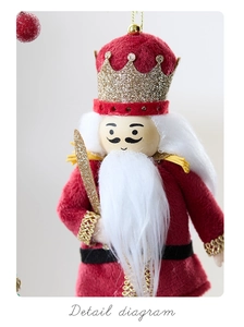 Macro detail of red velvet nutcracker king ornament with golden sequins and white fur