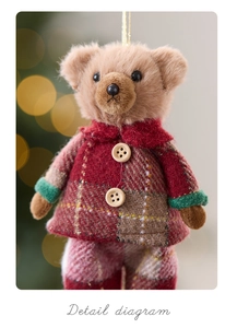 Detail of plush teddy bear ornament in red plaid coat with wood buttons for Christmas decor