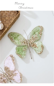 Detail of glittery fabric butterfly clips with sequins for Christmas tree decoration