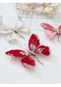 Detail of fabric butterfly clip with sequins and beads for Christmas tree decoration
