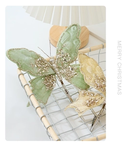 Detailed view of handmade sequined butterfly ornaments with metal clips in a basket
