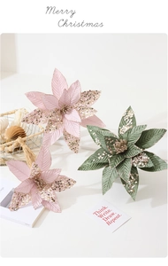 Detailed view of pink and dark green velvet poinsettias with gold glitter edges