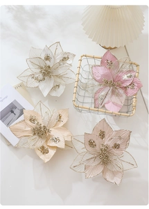 Close-up of 24cm glitter mesh poinsettias in soft pink, champagne, and white for Christmas