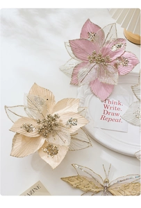 Close-up of sparkling 24cm mesh Christmas flowers and glitter butterflies for decor