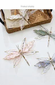 Detail of velvet mesh butterfly clips with gold glitter edges for festive decor