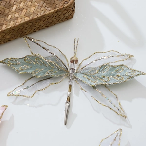 Light green tulle butterfly decoration with gold glitter and handmade bead accents